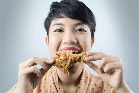 Woman To Eat Deep Fried Chicken On Gray Bacground Ratemds Health News