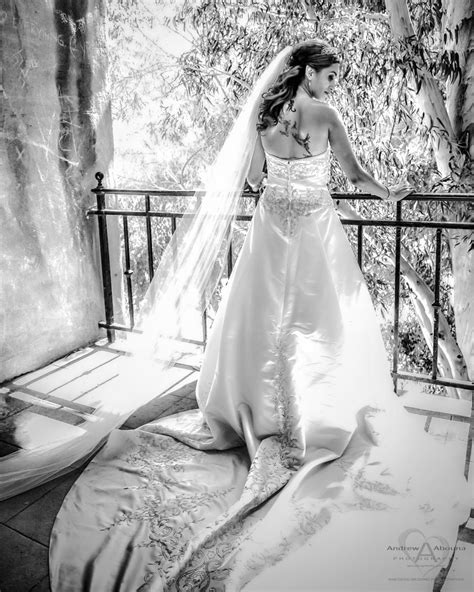 Bride In Strapless Wedding Dress With Long Train And Long Veil By Wedding Photographer San Diego