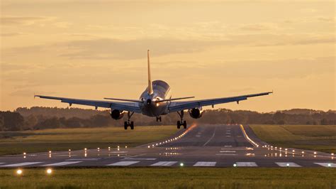 Airplane Taking Off Sunset