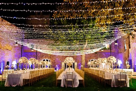 Long Reception Tables Under Strings Of Lights Photo By Nino Lombardo