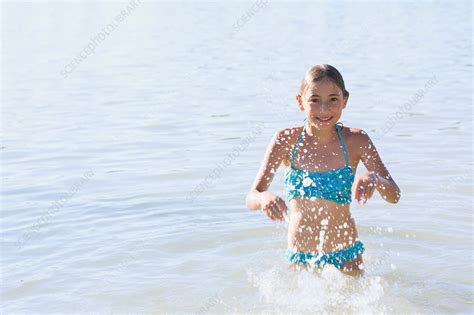 Girl Running And Splashing Stock Image F Science Photo Library