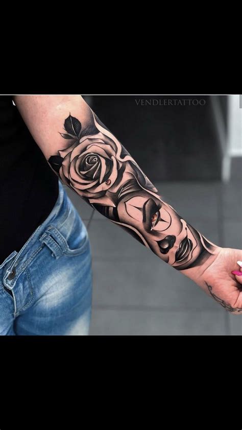 A Woman With A Rose Tattoo On Her Arm