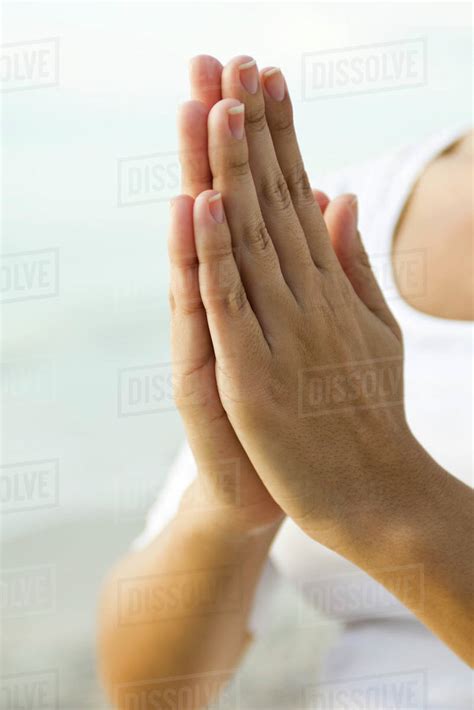 Womans Clasped Hands In Prayer Position Stock Photo Dissolve