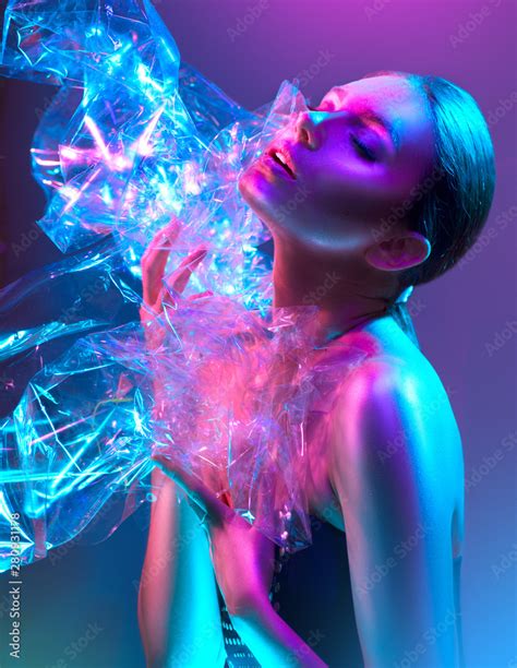 Fashion Model Woman In Colorful Bright Neon Lights Posing In Studio