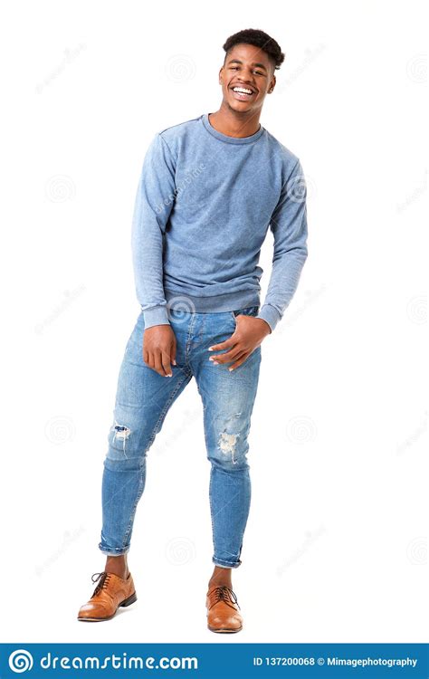 Full Body Smiling Young Black Man Standing Against Isolated White