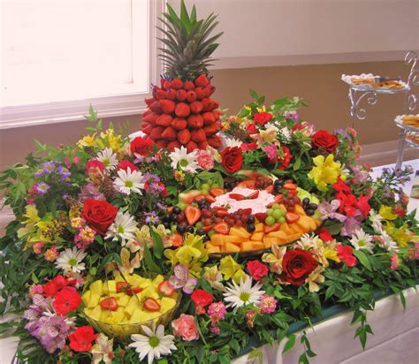 Fresh Fruit Cascade With Fresh Flowers And Greenery For An Abundance Of