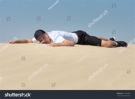 Tired Man Lying On Sand Desert Stock Photo 715092907 Shutterstock