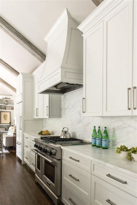The look of surface mount metal ceilings achieves an upscale modern look using a vintage visual from the late 19th century. White Contemporary Kitchen With Vaulted Ceilings | HGTV ...