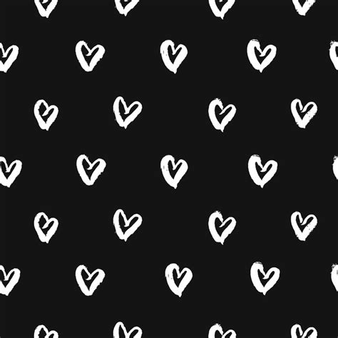 seamless pattern with hand drawn white hearts cute black and white background vector