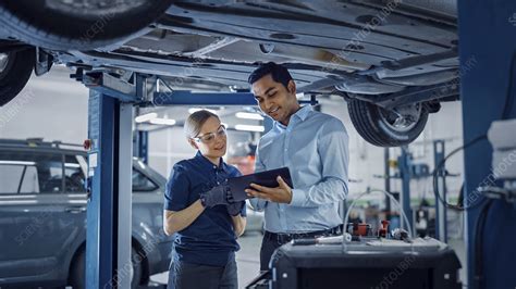 Mechanic And Service Manager Inspecting A Car Stock Image F0331277