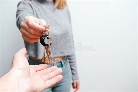 Focus On Female Hand Holding House Keys Woman Realtor Giving Bunch To