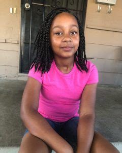 For this hairdo, part your hair down the middle and gather the upper portion of your hair in a bun while leaving some hair loose on the bottom half—secure bun with an elastic band and repeat on the other side. hairstyles for 10 years olds black girl (7) - Child Insider