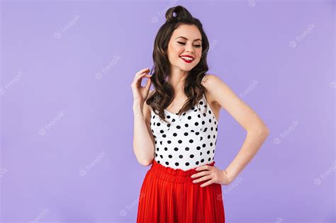 premium photo portrait of brunette pin up woman in vintage polka dot dress smiling and