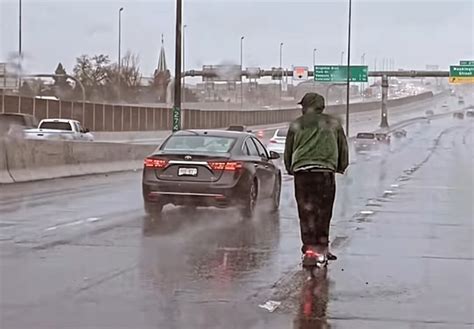 denver odd couple takes lime scooter on colorado s i 70 in pouring rain