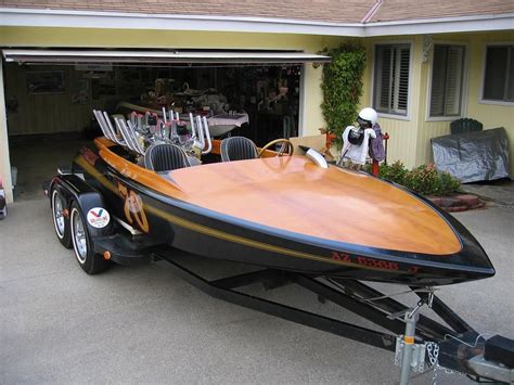 A Boat Is Parked In Front Of A Garage