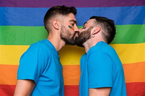Free Photo Homosexual Couple Of Male Kissing On Lgbt Rainbow Flag