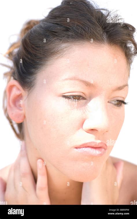 Portrait Of Young Woman Rubbing Her Sore Neck Neck Pain Stock Photo