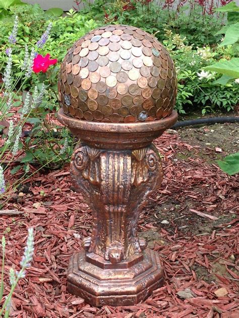 Bowling Ball Garden Art My Own Garden Art A Bowling Ball Covered In Pennies Sitting On The