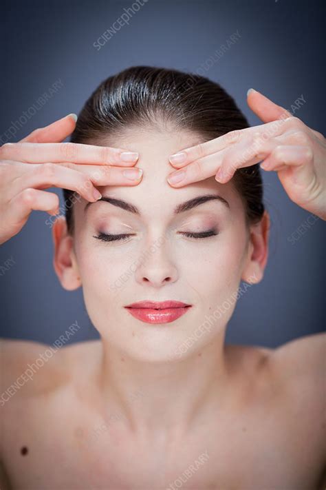 Woman Massaging Forehead Stock Image C0328083 Science Photo Library