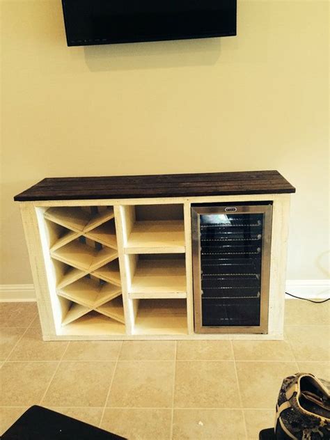 Wine fridges are a great invention if you want to precisely control the temperature of your wine and ensure that you're getting the right flavor profile with every sip. Buffet with wine rack and storage for wine cooler in 2019 ...
