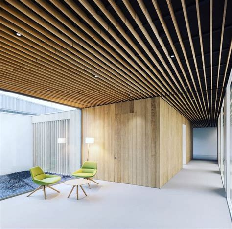 The Suspended Wooden Ceiling Of Spigogroup Creates Movement And Depth