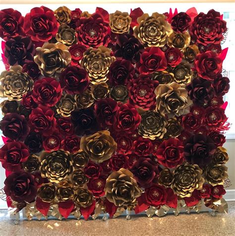 Paper gift bags features white, stiff woven handles and a simple white and kraft design with a diagonal gold foil stripe. Red and gold paper flowers for a beautiful wedding ...