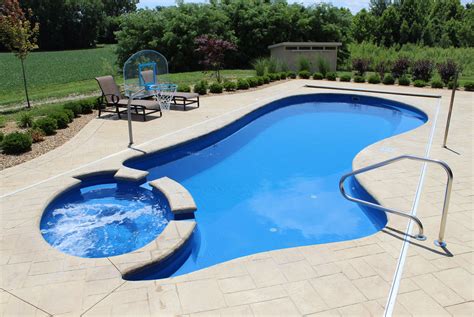 Luxury Backyard Pools Create An Inviting Retreat Hot Spot Pools Hot Tubs Bbq