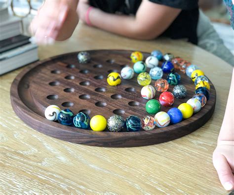 Wooden Game With Marbles Web Buy Wooden Marble Solitaire Board Game