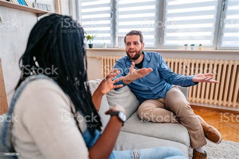 Young Mixed Race Couple Arguing At Home Stock Photo Download Image
