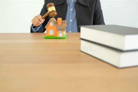 Lawyer With Judge Gavel Knocking House Model Real Estate Dispute