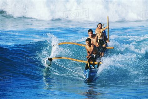 Hawaii Oahu Makaha Beach Three Local Men In Outrigger Canoe Surfing