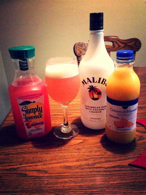 Malibu rum is an essential liquor for your home bar. Malibu Coconut Rum, raspberry lemonade, orange juice, ice ...