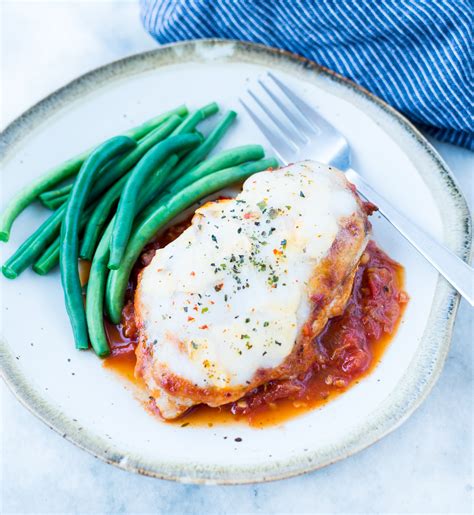 Chicken is smothered in marinara sauce with melted mozzarella cheese on top! MOZZARELLA CHICKEN | The flavours of kitchen