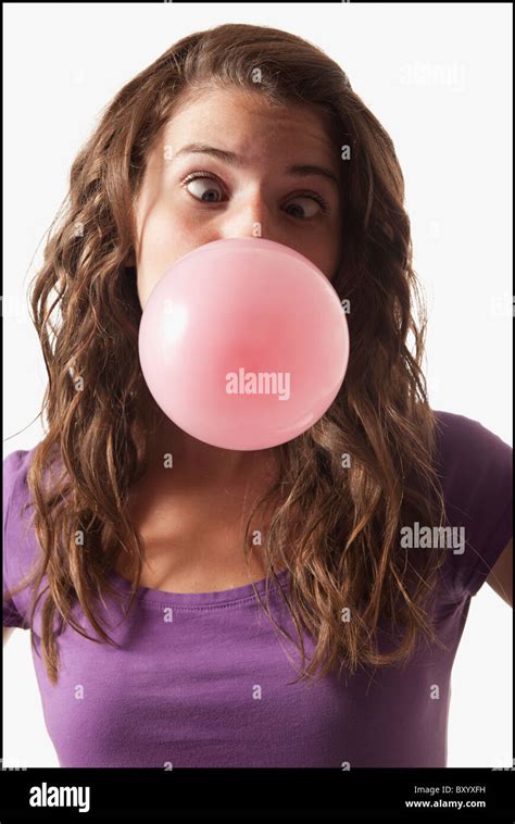 Young Woman Blowing Bubble Gum Stock Photo Alamy