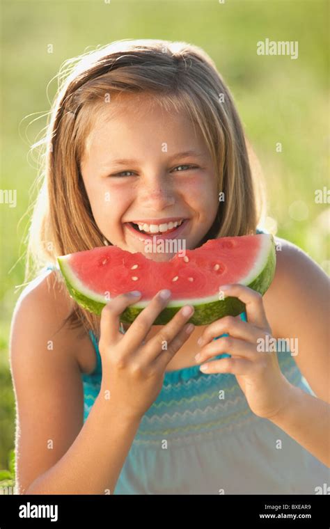 Young Girl Eating A Slice Of Watermelon Stock Photo Alamy