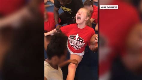 disturbing videos show denver high school cheerleaders forced into splits nbc news