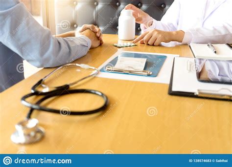 Doctor Explaining Patient Symptoms Or Asking A Question Stock Image