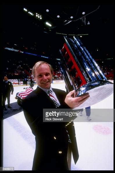 Assistant Coach John Cunniff Of The United States Displays A Trophy