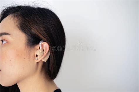 Asian Women Are Wearing Hearing Aids In Order To Hear Better Stock Image Image Of Closeup
