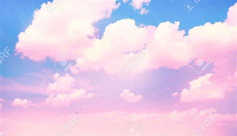 Blue Sky Background With Pink Clouds Stock Photo Picture And