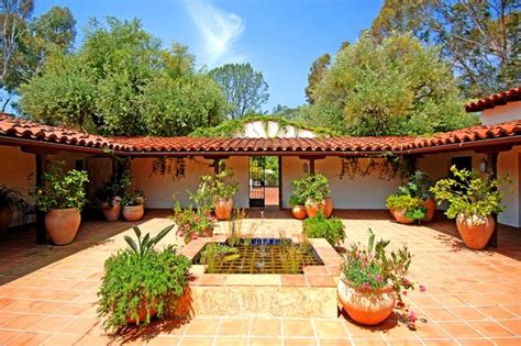 During the 1900s, when hacienda homes were further popularized by the colonial revival movement, many homebuilders chose to build their houses with traditional materials, like adobe and clay, rather than utilizing them out of necessity. Spanish Courtyard | Hacienda style homes, Spanish style ...
