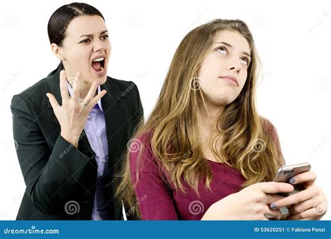 Mother Shouting And Yelling At Daughter Chatting With Phone Stock Image