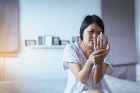 Young Asian Woman Having A Wrist Or Hand Painfemale Feeling Exhausted