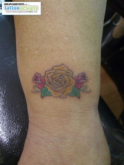 A small rose tattoo placed behind the ear looks so cool and cute. 1990Tattoos: Cute Rose Tattoos on Wrist