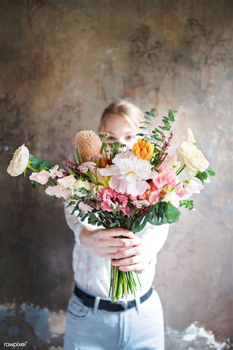 Check spelling or type a new query. Woman holding a bouquet of flowers | premium image by ...