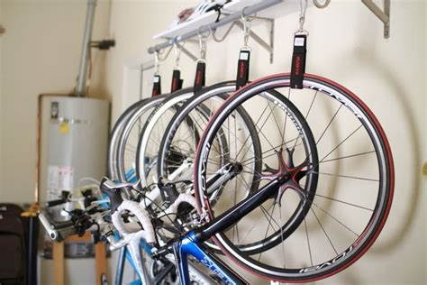 Instead of having your bike take up space in your home, consider hanging it from the ceiling of your garage, attic, basement, or other storage area! DIY Hanging Bike Rack for Multiple Bikes | Diy bike rack ...