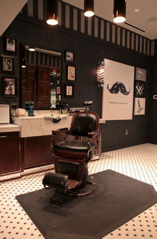 An Old Fashioned Barber Chair In The Middle Of A Room With Black And White Flooring