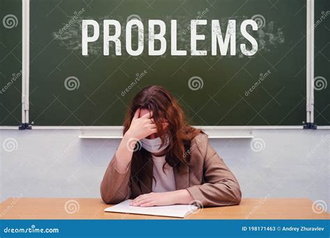 Sad Teacher Sits In A School Class With The Words Stock Image Image Of Depression Education
