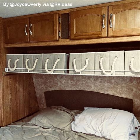 so smart this rv owner installed a wire closet shelf above her bed and added collapsible