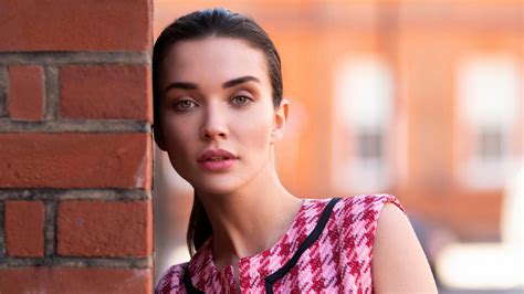 Green Eyes Amy Jackson Is Standing Near Brick Wall Wearing Red Black
